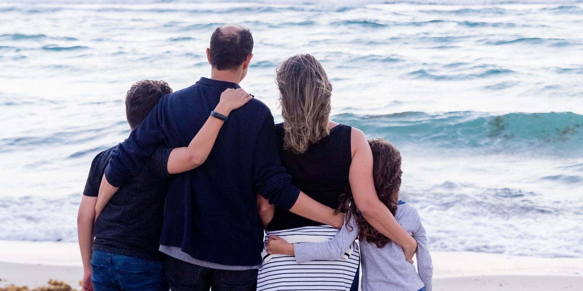Family looking at the ocean wondering Why You Need A Probate Attorney